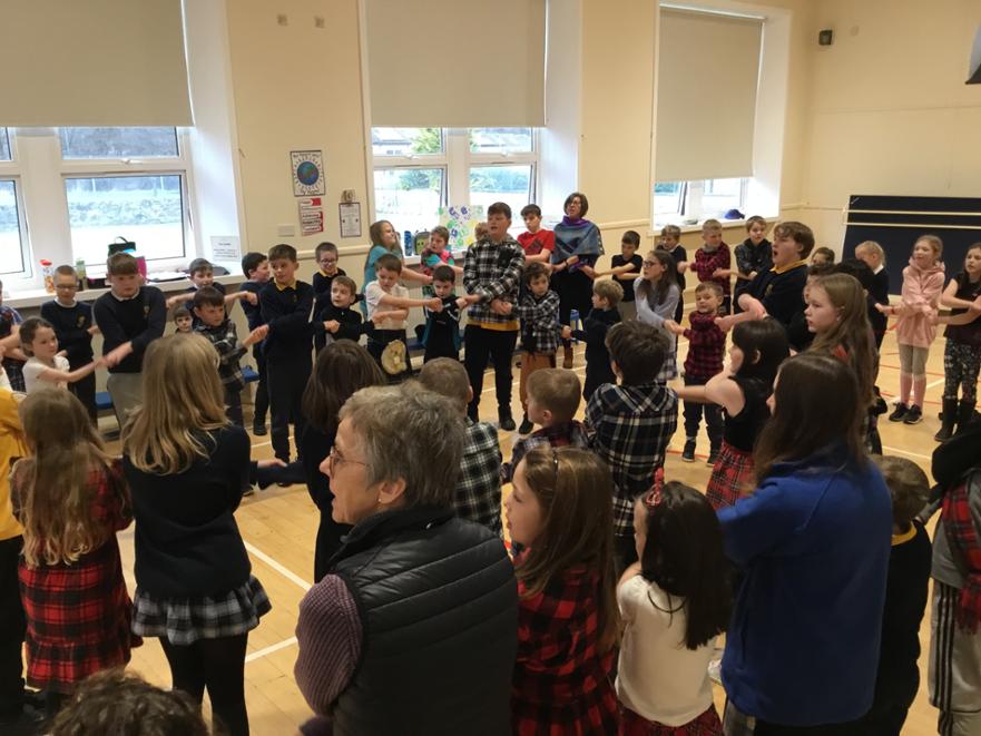 29. whole school perform auld land syne 