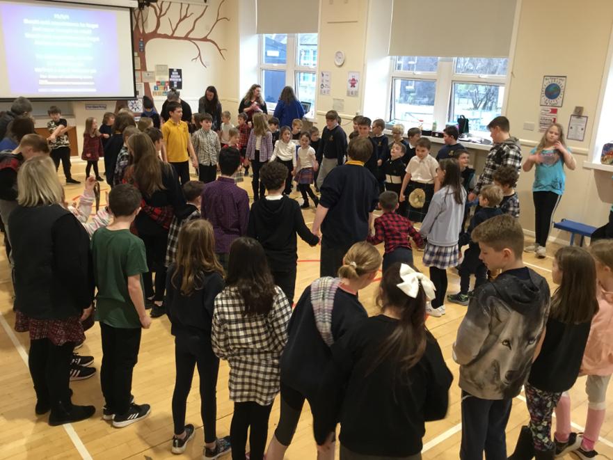 28. whole school perform auld land syne 